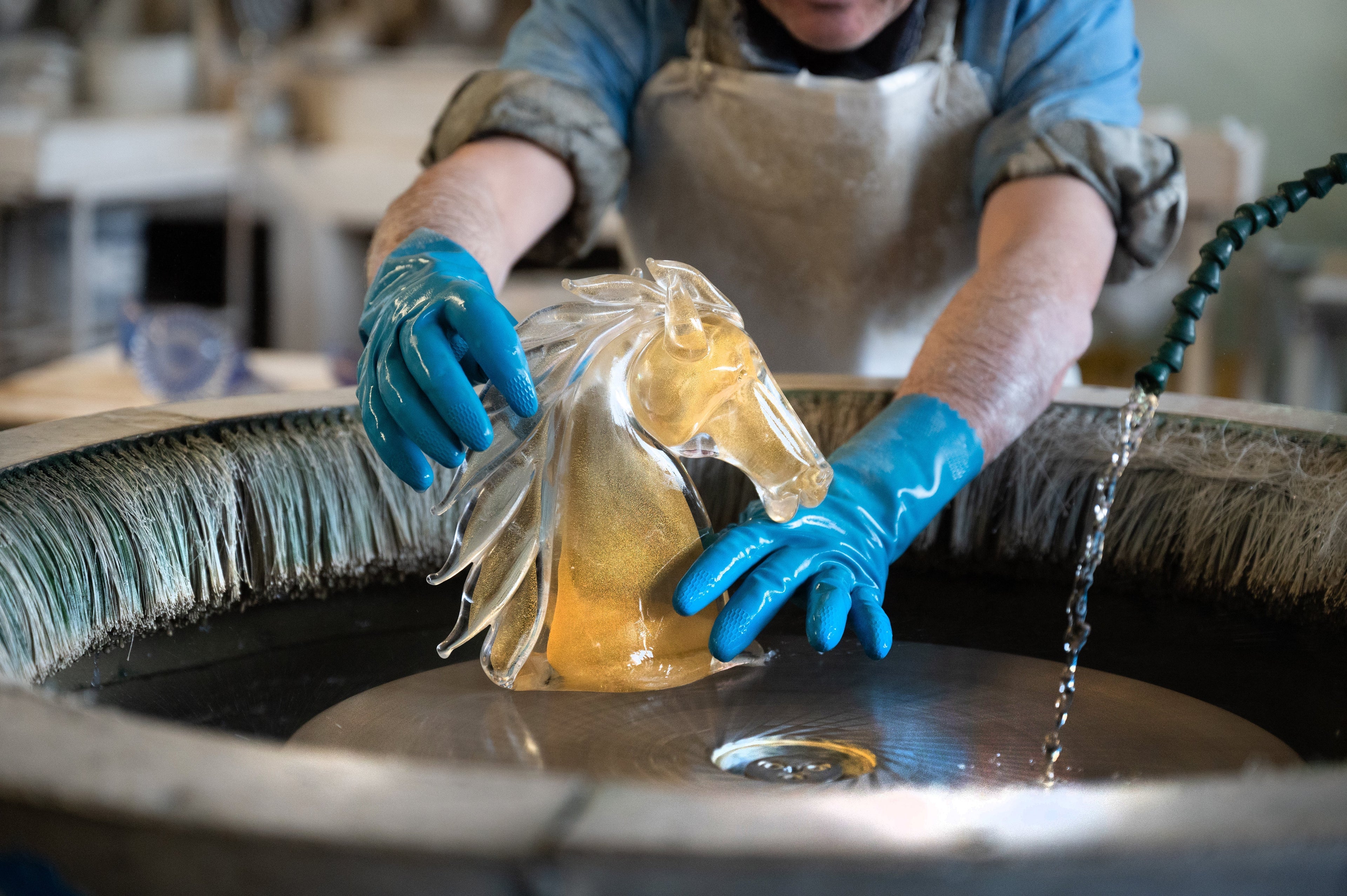 Duccio Di Segna amber crystal Horse's Head sculpture being rinsed by a master in the Tuscan atelier