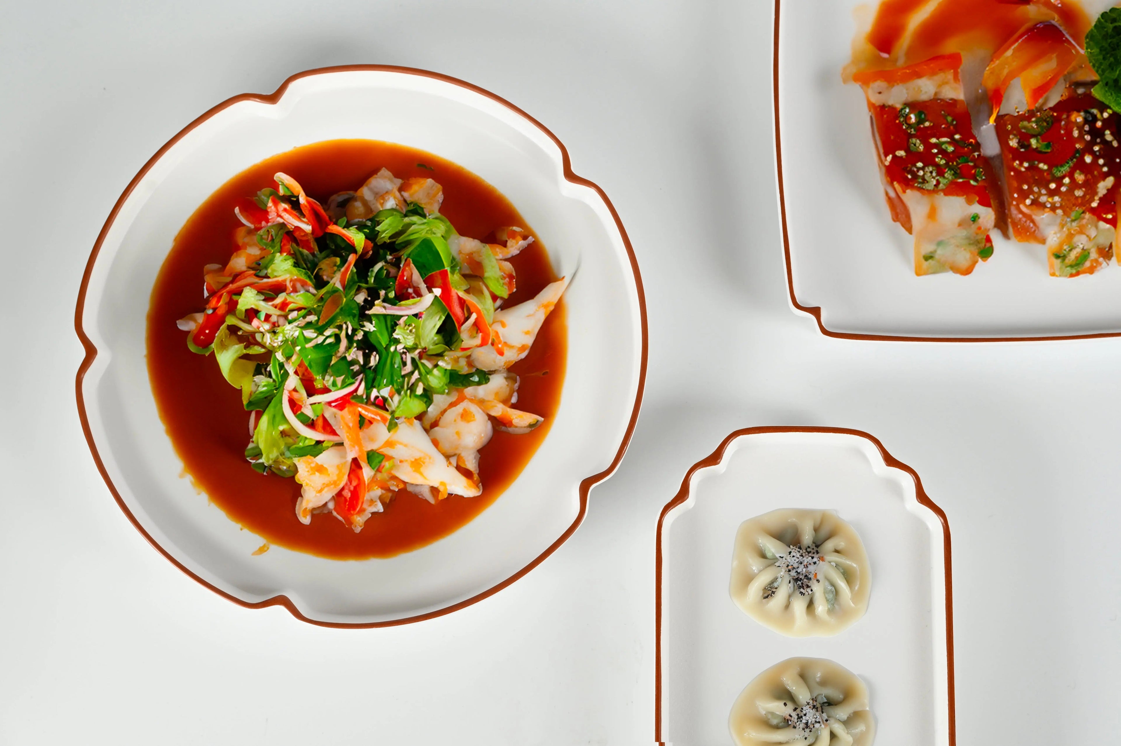 Cosmopolitan plate set — white porcelain with terracotta rim, modern geometric shapes by Amprio Milano