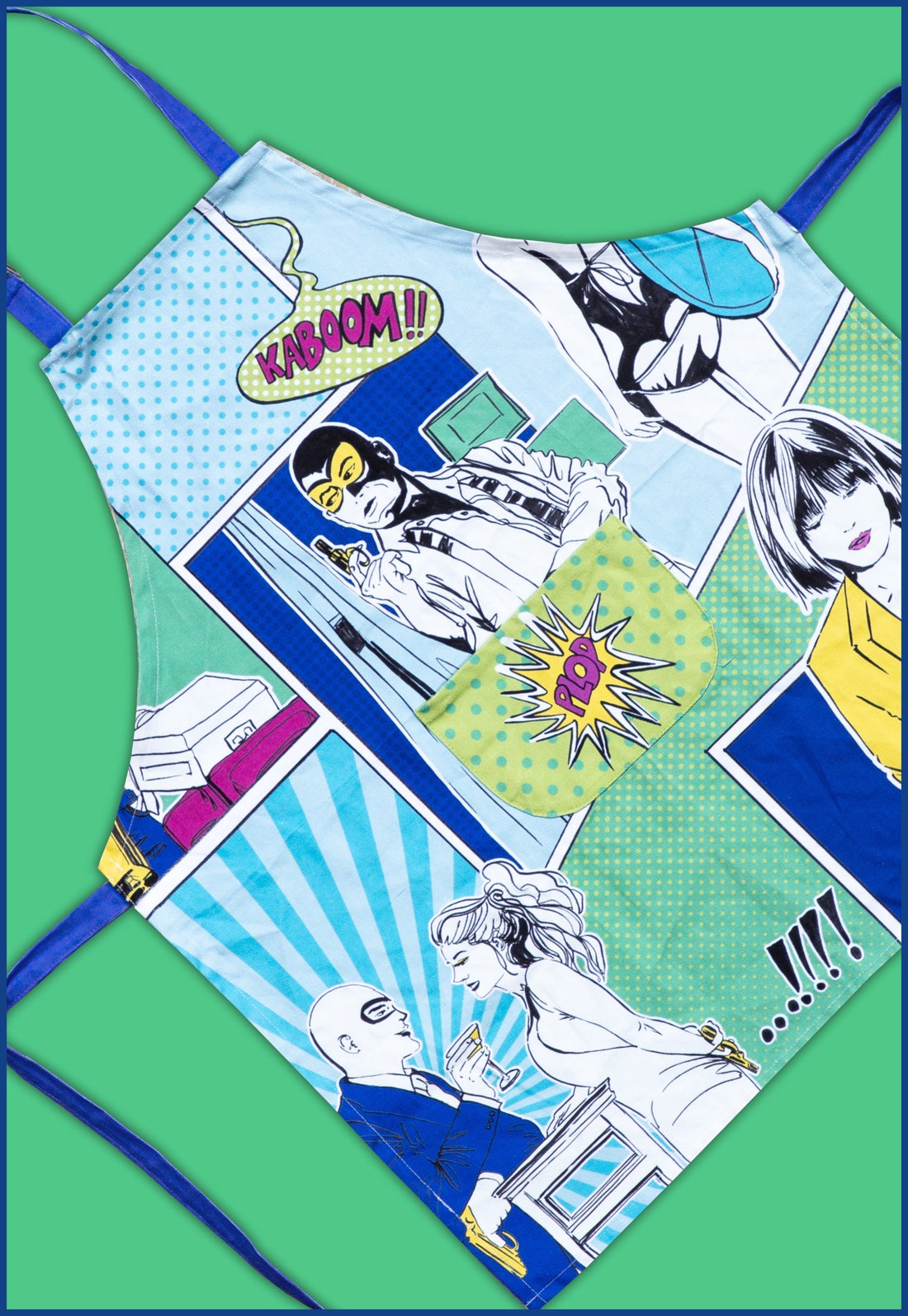 Gulp pop-art apron with comic panels and front pocket in blue-green tones — kitchen textile by Amprio Milano.