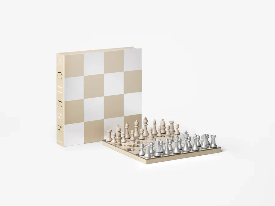 Printworks Chess set — beige board with silver and sand pieces, book-shaped storage box open, curated by Amprio Milano.