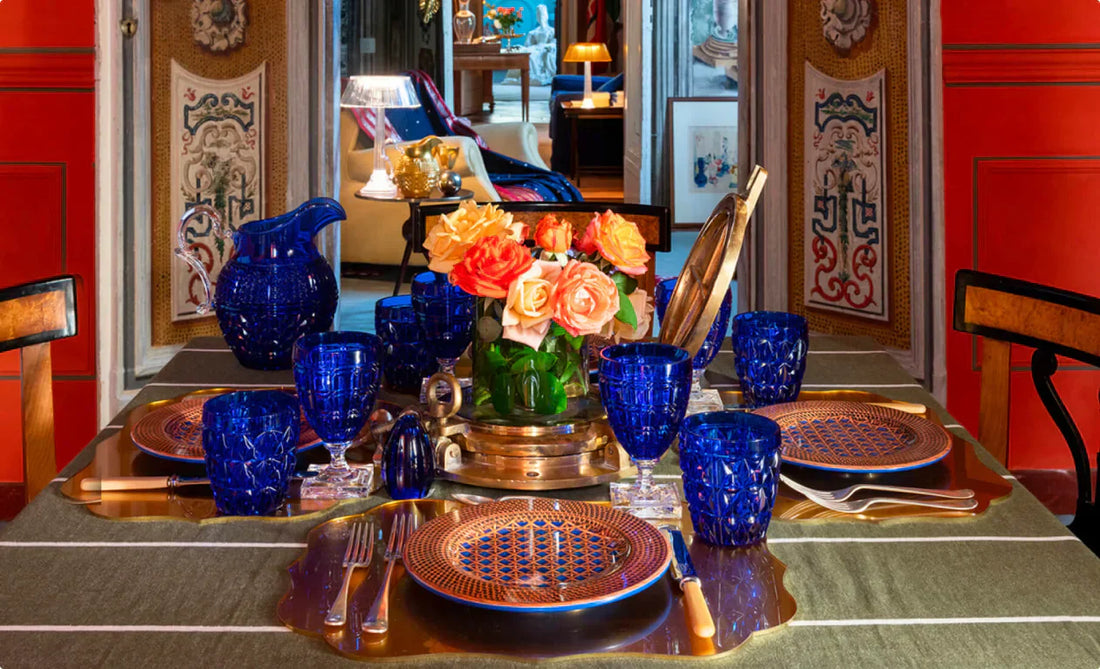 Italian tableware by Mario Luca Giusti in Dubai: blue synthetic-crystal drinkware, patterned plates and gold accents for elegant hosting