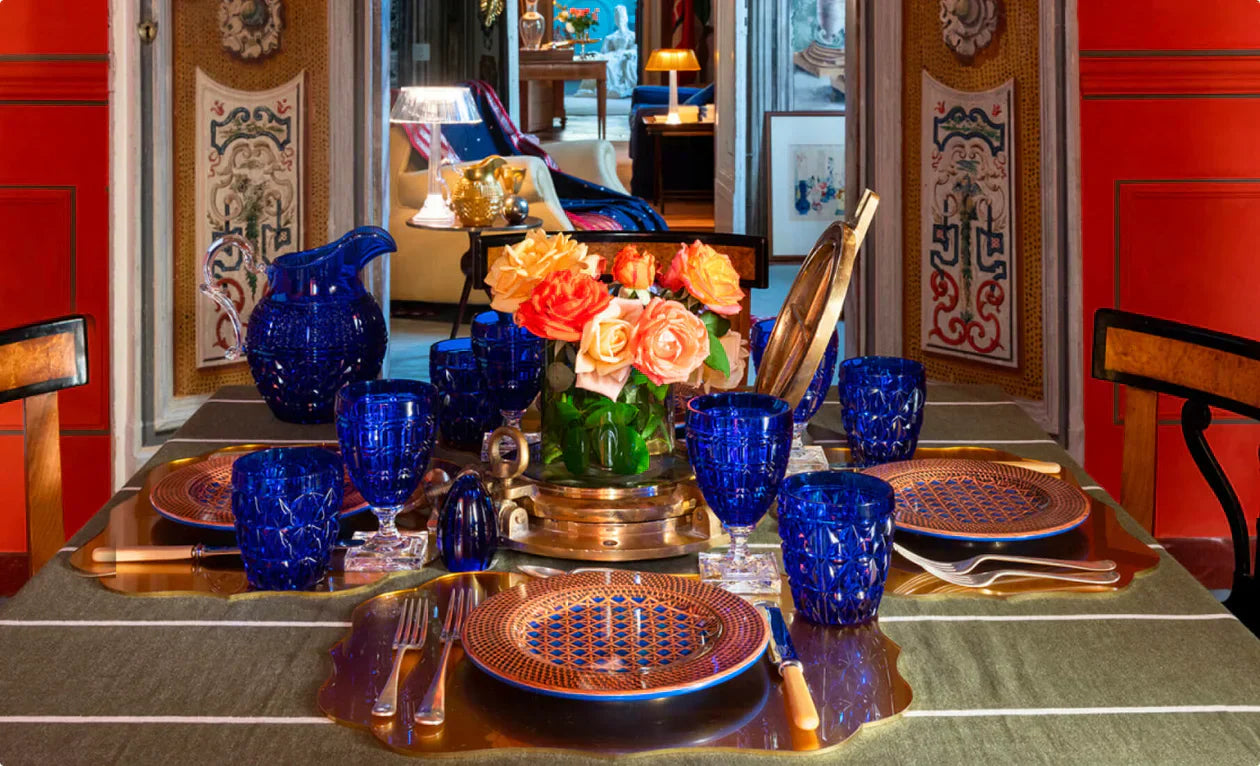 Italian tableware by Mario Luca Giusti in Dubai: blue synthetic-crystal drinkware, patterned plates and gold accents for elegant hosting
