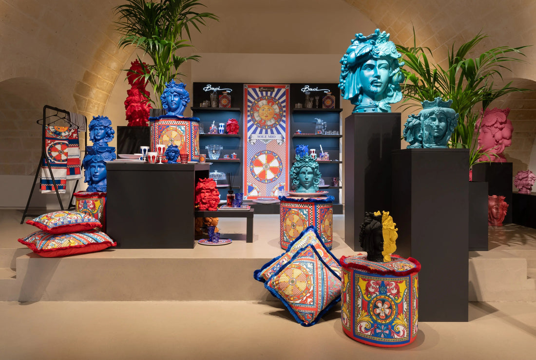 Sole Mio showcase — Sicilian sun motif décor with Moorish-head vases, patterned plates and cushions by Amprio Milano